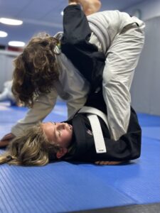 WDC youth class grappling on the mat